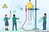 Tiny people around an oversized chemistry experiment where an electric spark is going off in a gas syringe.