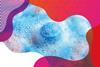 photo of a blue bath bomb surrounded by blue and pink bubbles