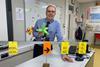 Graham Hewston holding a balloon model of electron orbitals in his science classroom