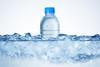 A bottle of liquid water in ice
