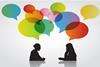 Colourful speech bubbles above two women in conversation in silhouette