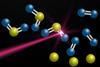 Molecules of sulfur dioxide being broken down by a laser into oxygen and sulfur