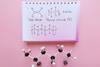 A photo of a PVC model and the PVC chemical structure written in a notebook
