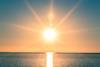 picture of sun setting over the sea