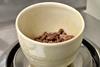 Close-up of crucible on mass balance
