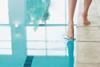 Dipping a toe in an indoor swimming pool