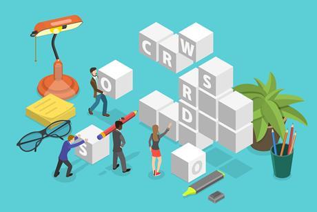 A cartoon of people assembling giant cubes into a crossword
