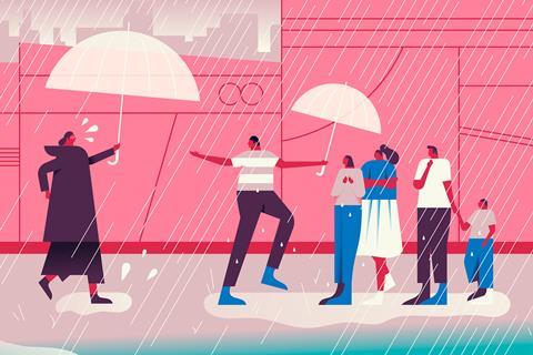 A woman with an umbrella rushes to cover a group of people in the rain